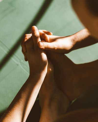 Close-up on a person's feet on a yoga mat, showing focus on stability.
